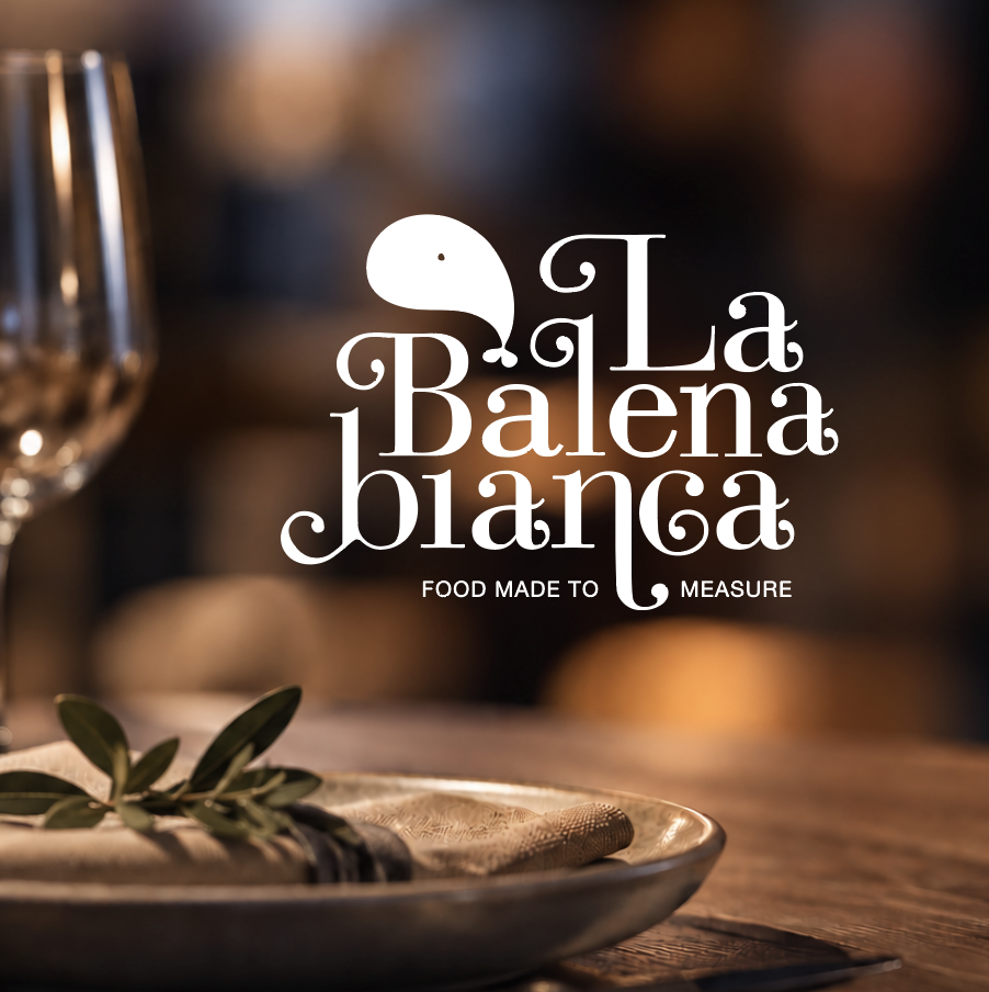 Logo La Balena Bianca ambientato su una tavola apparecchiata